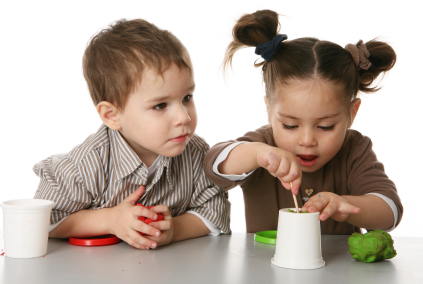 toddlers playing next to each other